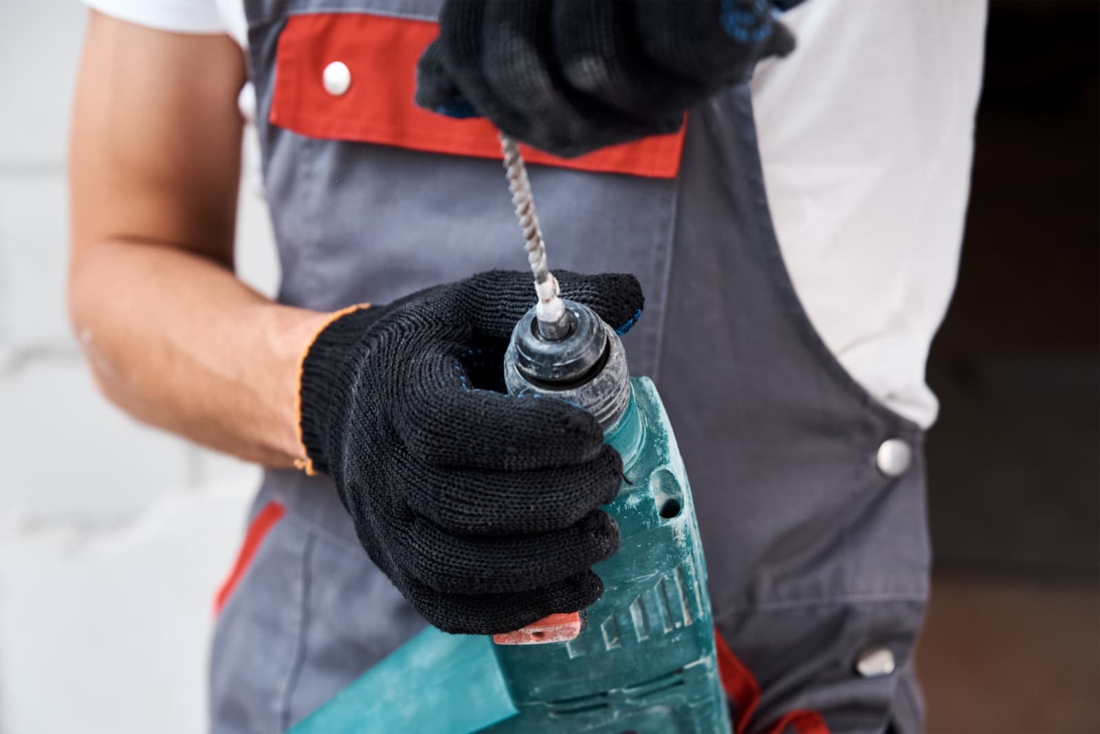 Worker using a power tool on an outdoor construction job