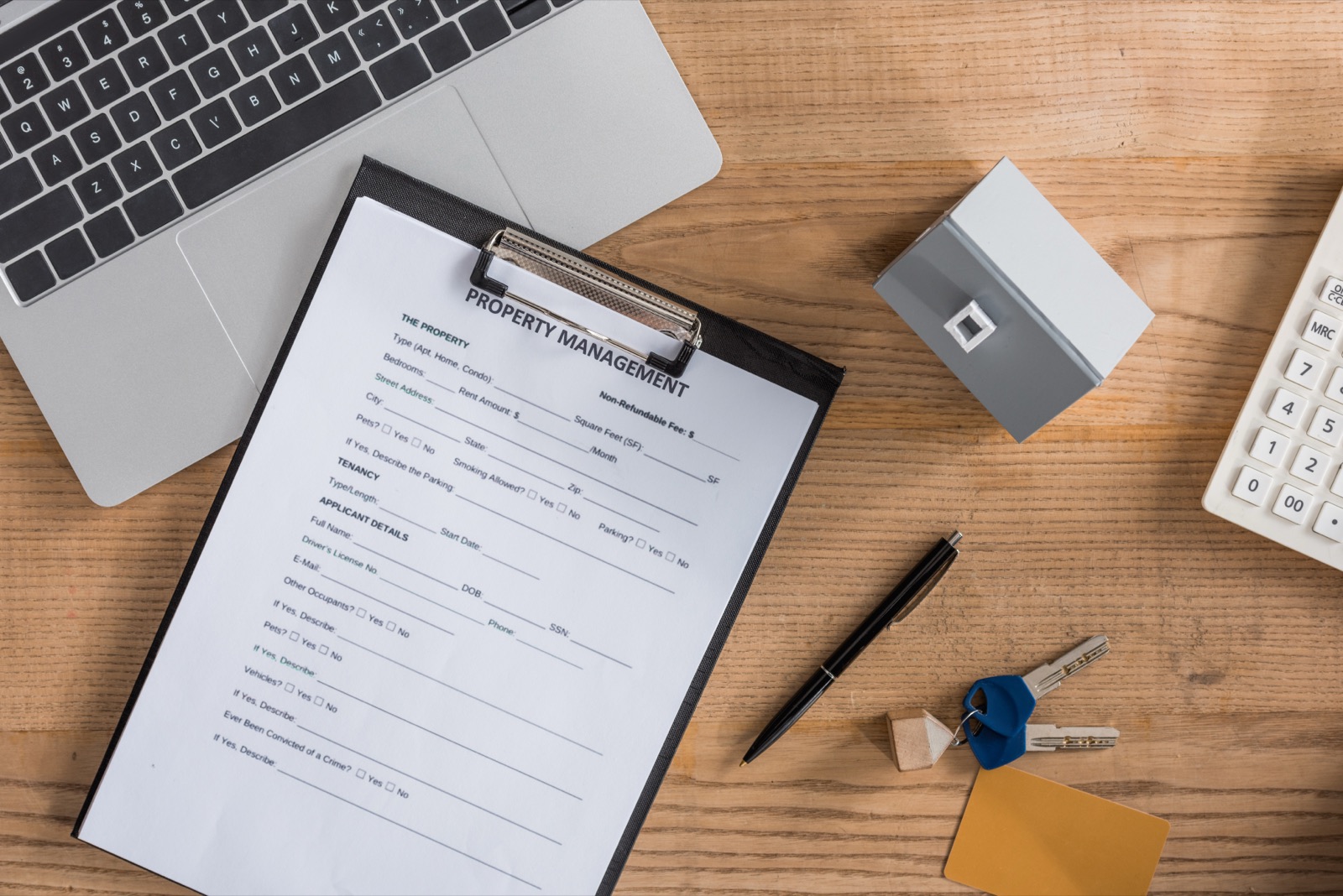 Property management agreement on a clipboard for priority scheduling accounts